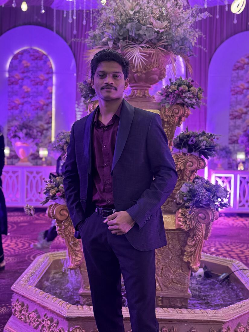 S. Brahma Reddy in a dark suit at an evening venue