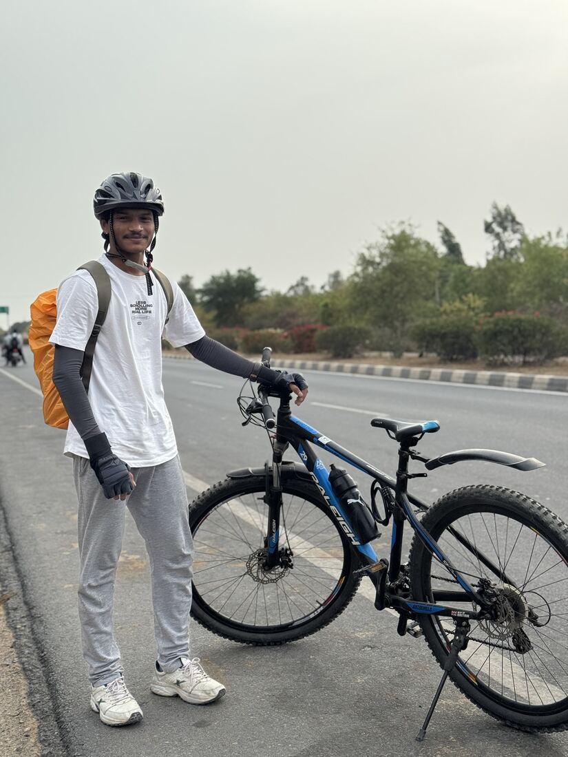 With a bicycle on an open road